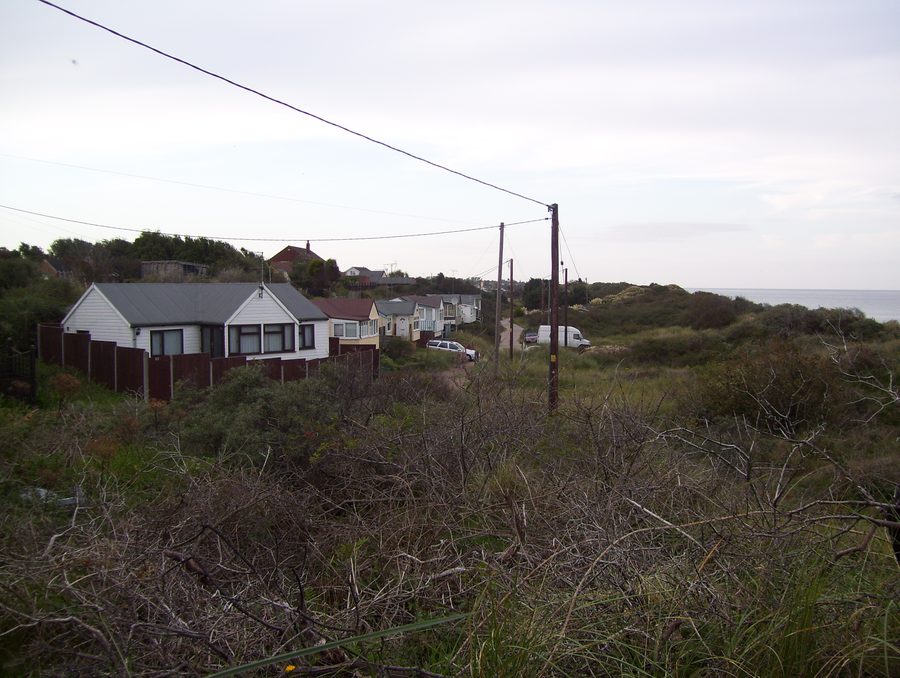 Cabanes de plage et dunes de sable à Hemsby