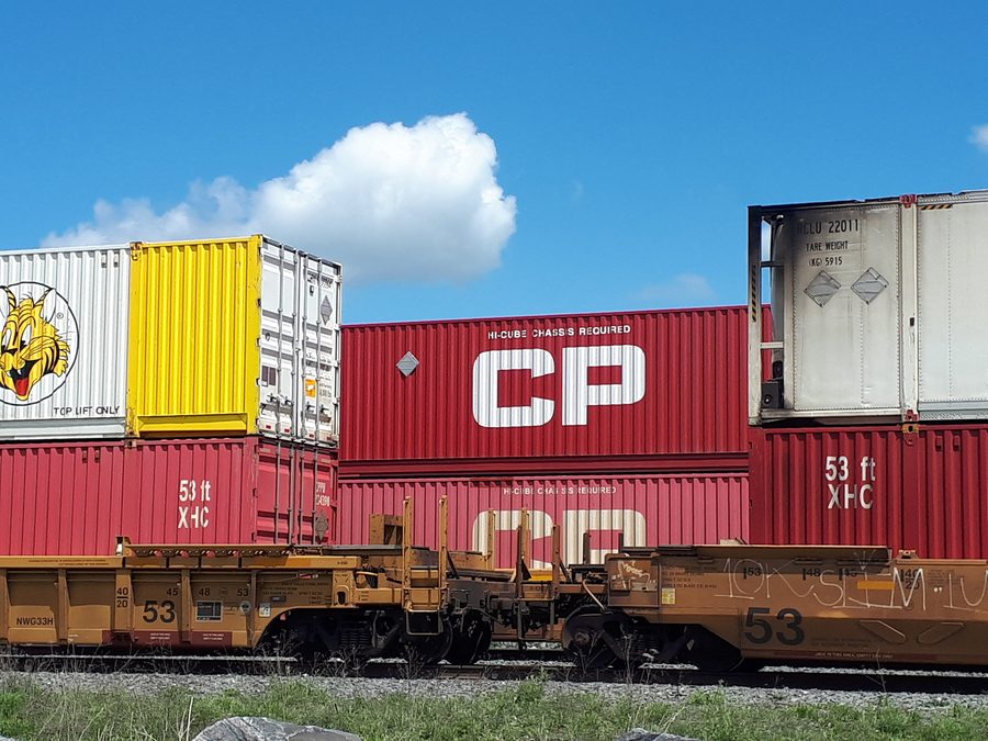 Two trains loaded with shipping containers at Mactier Yard in Mactier, Ontario